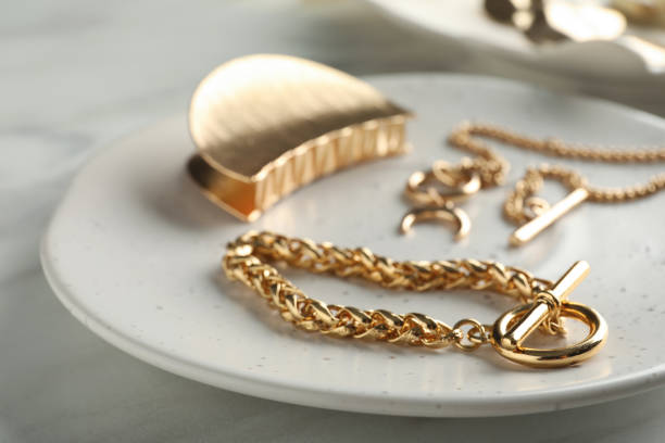 Different elegant bijouterie on white table, closeup